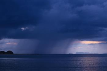 Dark rain clouds over the sea